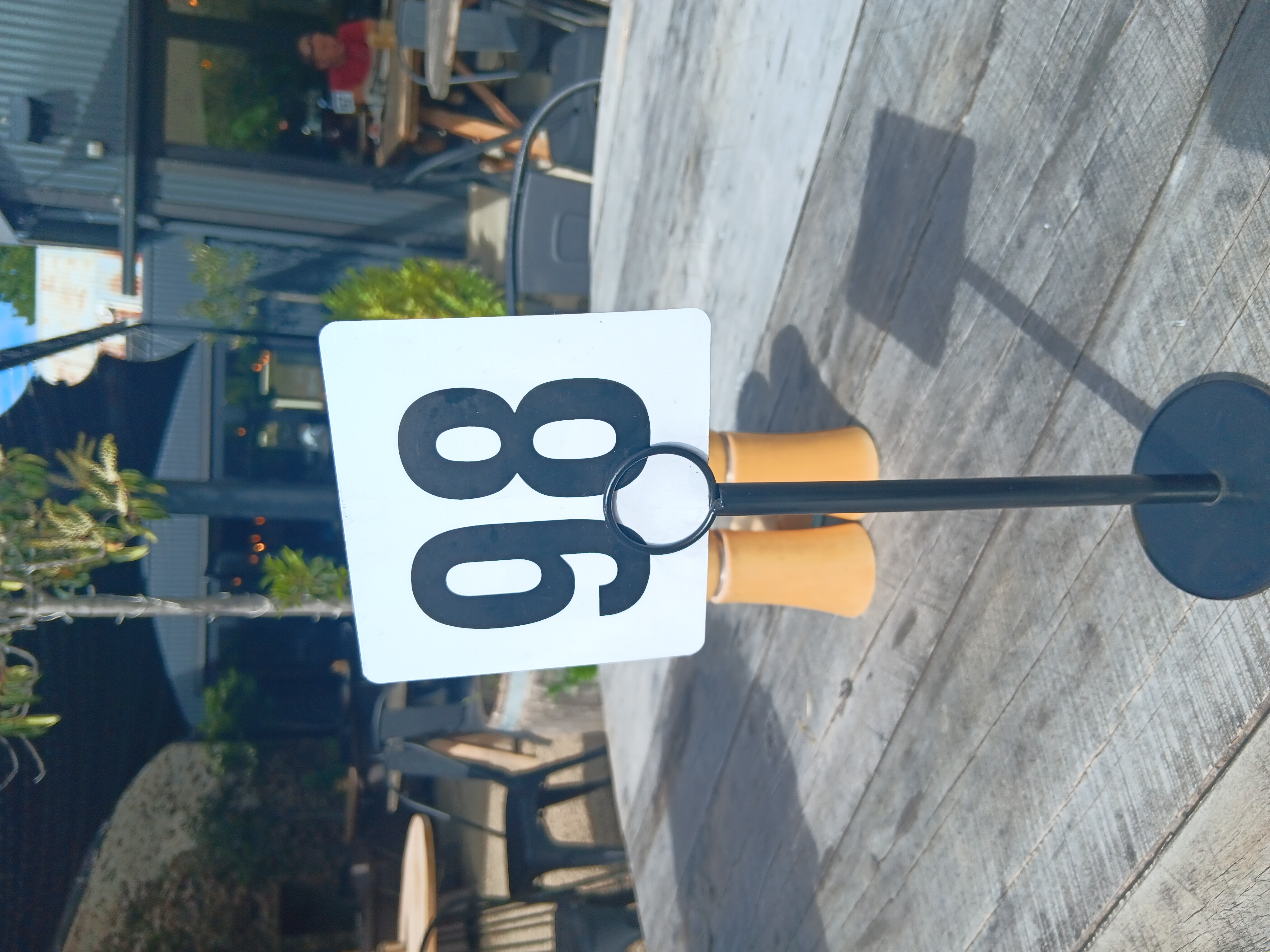 A café sign with the number 98