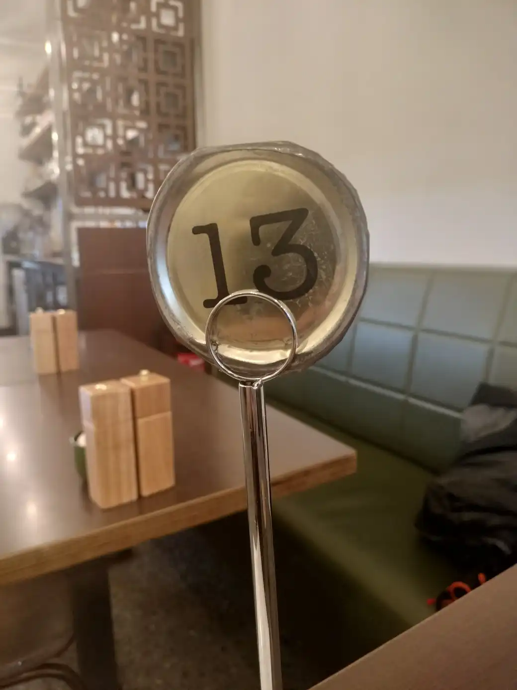 A café sign with the number 13
