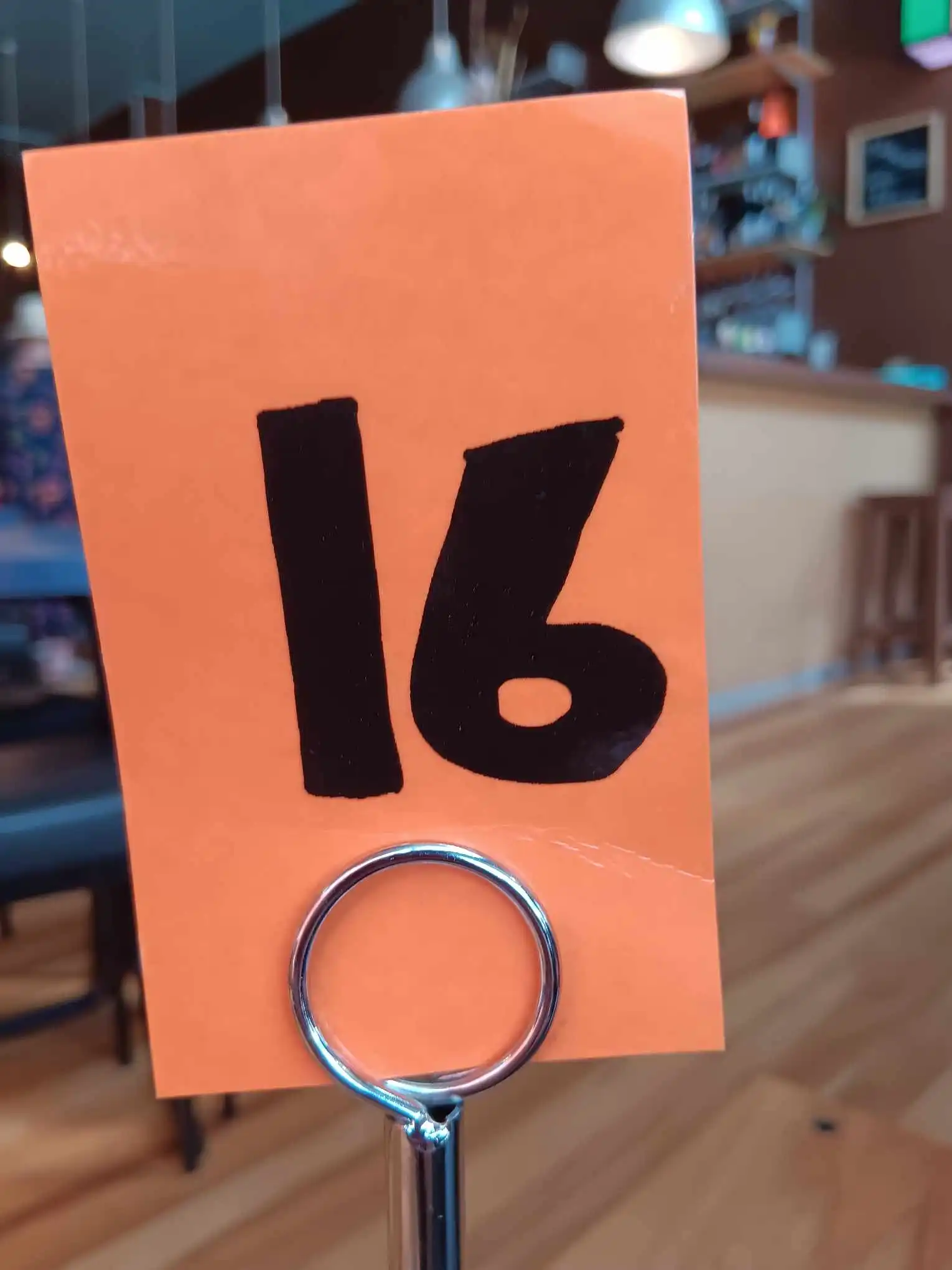 A café sign with the number 16