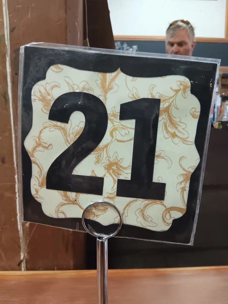 A café sign with the number 21