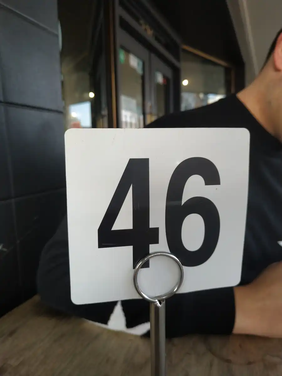 A café sign with the number 46