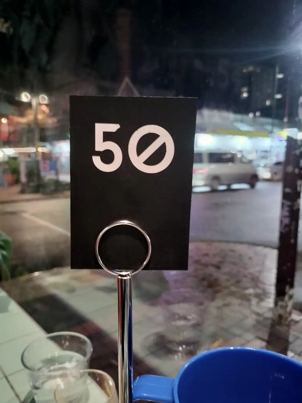 A café sign with the number 50