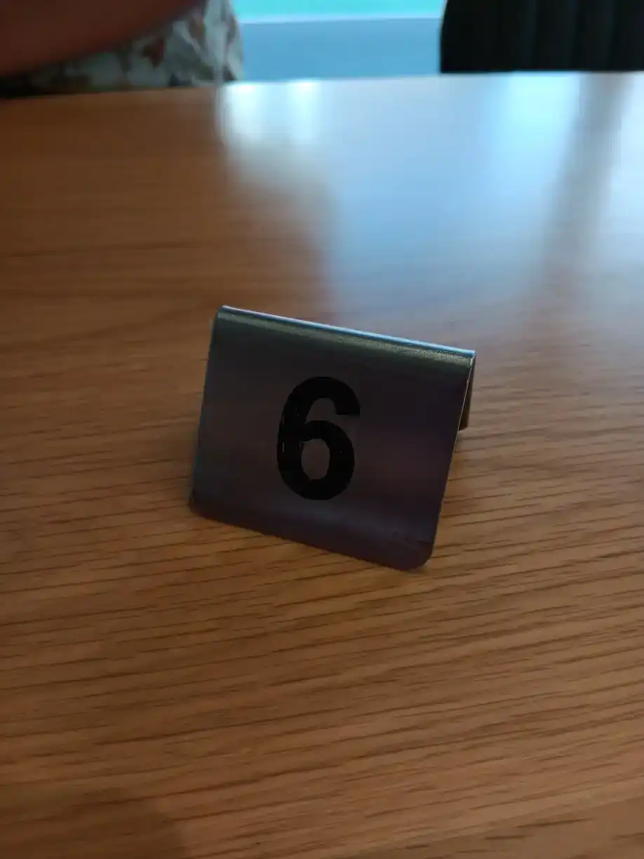 A café sign with the number 6